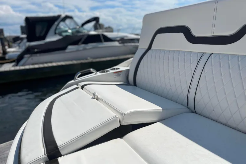  Yacht Photos Pics 2018 Sea Ray SLX 350 boat with luxurious white seating at a marina.