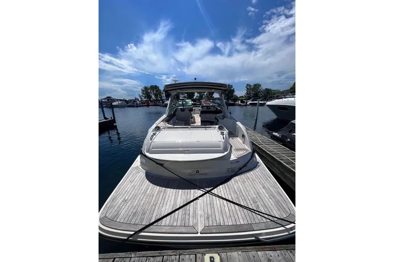 Yacht Photos Pics 2018 Sea Ray SLX 350 boat docked at marina under clear blue sky.