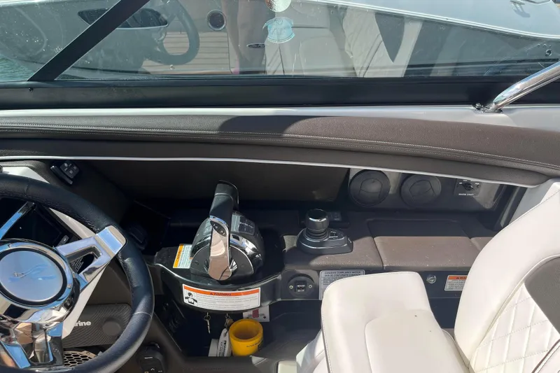  Yacht Photos Pics Interior cockpit of a 2018 Sea Ray SLX 350 boat with steering wheel and controls.