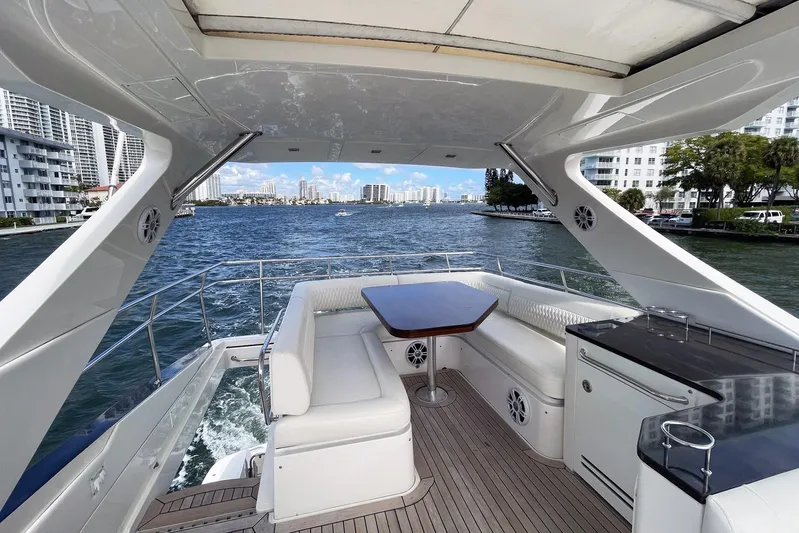 Discover Yacht Photos Pics Luxurious 2015 Sea Ray 510 Fly yacht with spacious deck and scenic waterfront view.