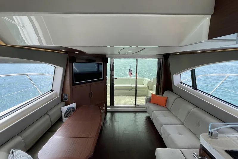Discover Yacht Photos Pics Luxurious interior of 2015 Sea Ray 510 Fly yacht with modern seating and ocean view.