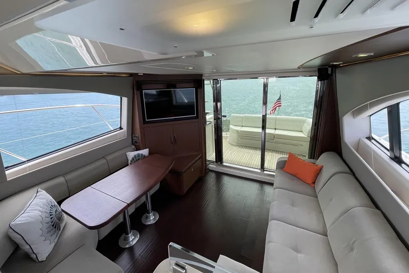 Discover Yacht Photos Pics Luxurious interior of 2015 Sea Ray 510 Fly yacht with spacious seating and ocean view.
