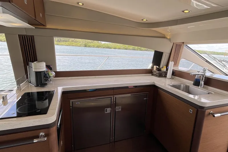Discover Yacht Photos Pics Luxurious kitchen interior of 2015 Sea Ray 510 Fly yacht with modern amenities.