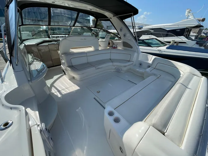  Yacht Photos Pics Spacious 2000 Sea Ray 460 Sundancer yacht interior with white seating and sleek design.