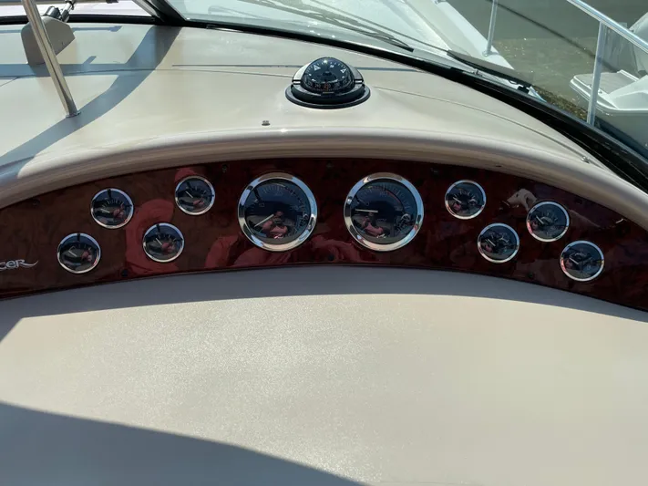  Yacht Photos Pics Dashboard of 2000 Sea Ray 460 Sundancer with multiple gauges and compass.