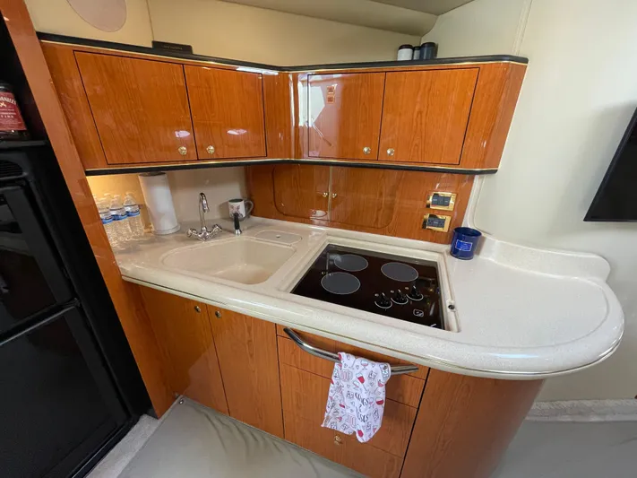  Yacht Photos Pics Luxurious 2000 Sea Ray 460 Sundancer yacht kitchen with wood cabinets and modern appliances.