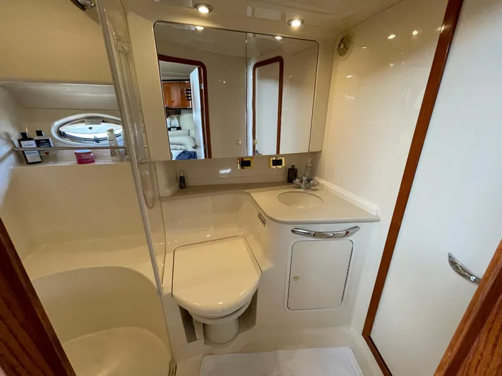 Yacht Photos Pics Luxurious bathroom in 2000 Sea Ray 460 Sundancer yacht with modern fixtures and ample lighting.