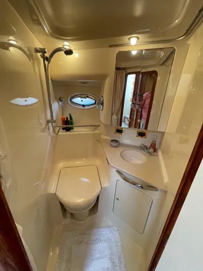  Yacht Photos Pics Luxurious bathroom in 2000 Sea Ray 460 Sundancer yacht with modern amenities.