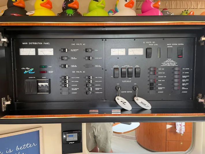  Yacht Photos Pics Main distribution panel of 2000 Sea Ray 460 Sundancer with colorful rubber ducks on top.