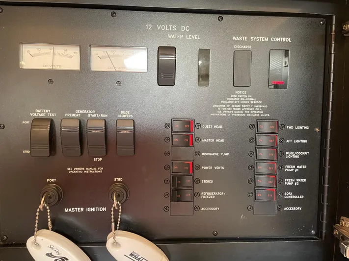  Yacht Photos Pics Control panel of a 2000 Sea Ray 460 Sundancer boat, featuring switches and gauges.