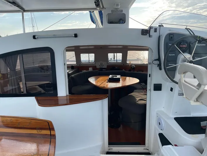  Yacht Photos Pics Interior view of 2006 Fountaine Pajot LAVEZZI catamaran, featuring a cozy dining area.