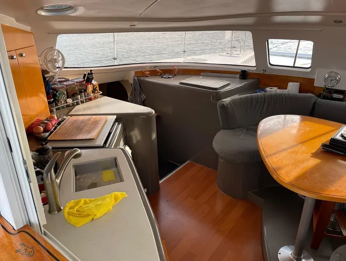  Yacht Photos Pics Interior of 2006 Fountaine Pajot LAVEZZI catamaran with kitchen and dining area.