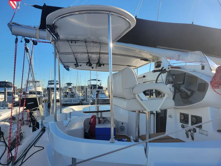  Yacht Photos Pics 2006 Fountaine Pajot LAVEZZI catamaran helm station with marina background.