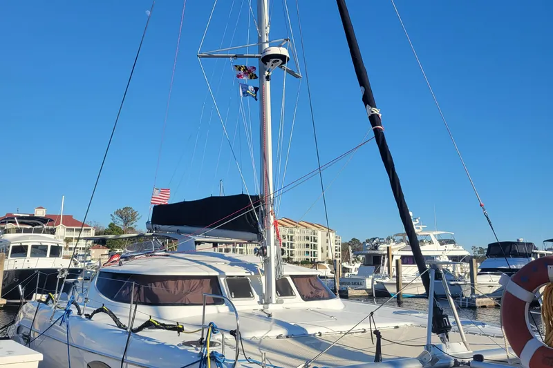  Yacht Photos Pics 2006 Fountaine Pajot LAVEZZI catamaran docked at marina under clear blue sky.