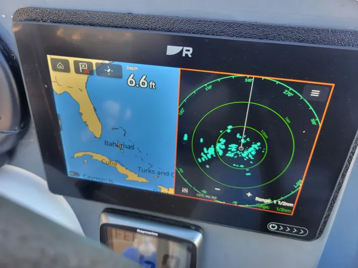  Yacht Photos Pics Navigation display on 2006 Fountaine Pajot LAVEZZI, showing map and radar with 6.6 ft depth.