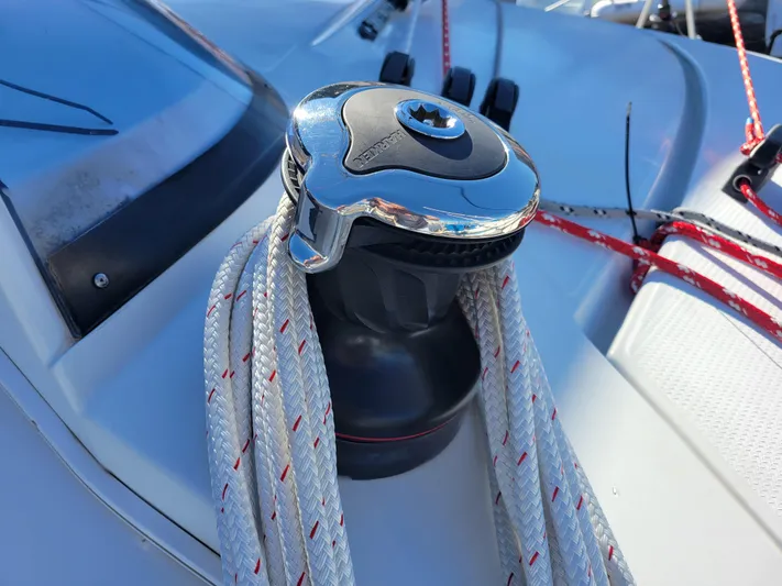  Yacht Photos Pics Winch on 2006 Fountaine Pajot LAVEZZI catamaran with ropes, close-up view.
