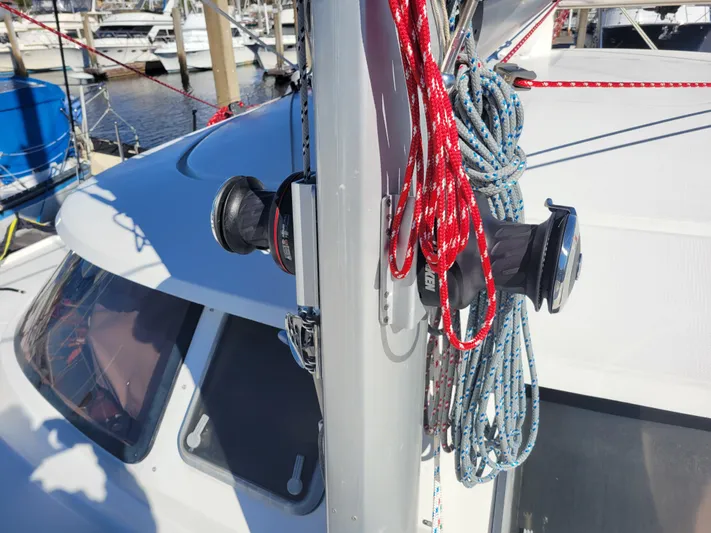  Yacht Photos Pics 2006 Fountaine Pajot LAVEZZI sailboat mast with winches and ropes in a marina.