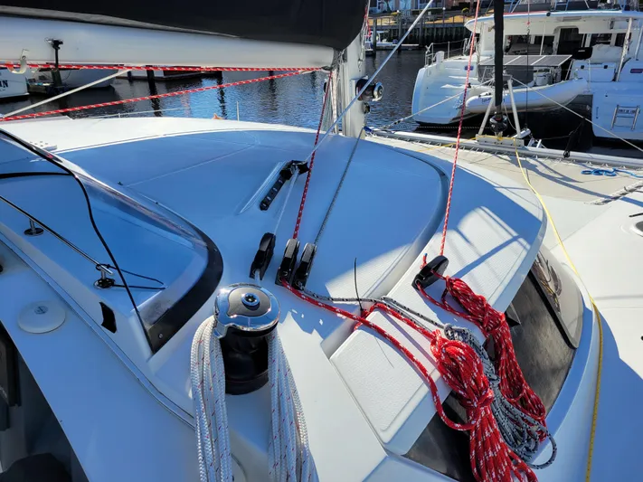  Yacht Photos Pics 2006 Fountaine Pajot LAVEZZI catamaran deck with ropes and winch in marina setting.