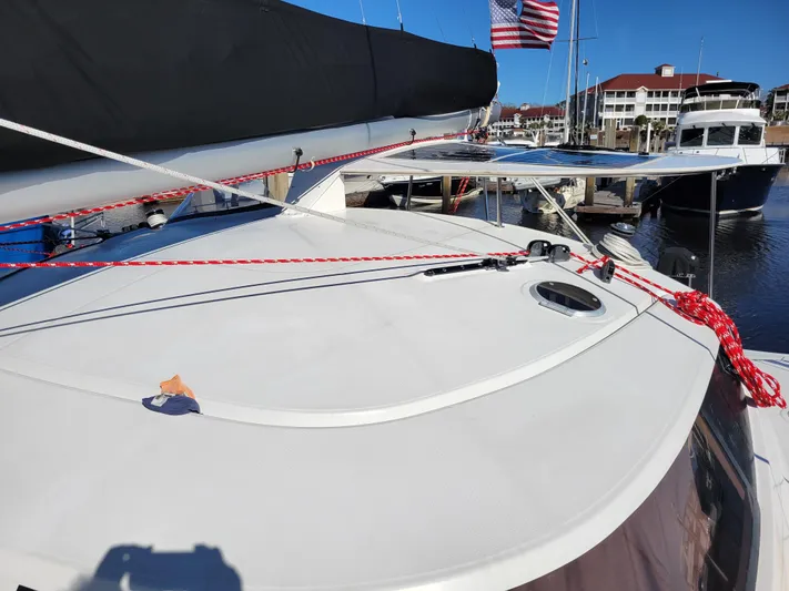  Yacht Photos Pics 2006 Fountaine Pajot LAVEZZI catamaran deck with rigging, docked at marina.