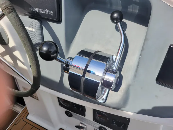  Yacht Photos Pics Throttle control on 2006 Fountaine Pajot LAVEZZI catamaran, featuring chrome levers and Raymarine equipment.