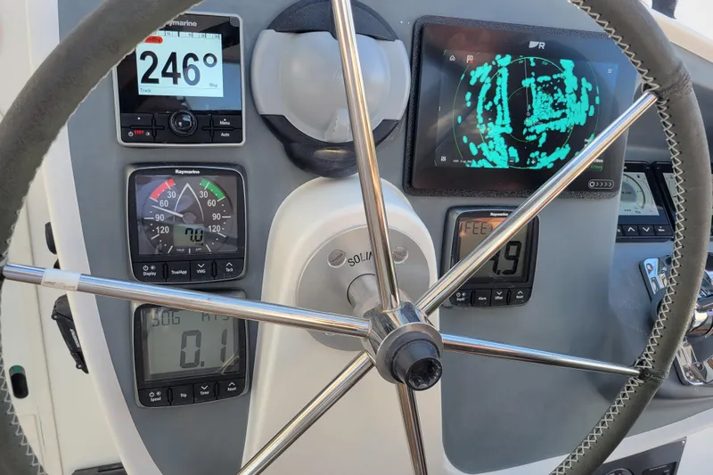  Yacht Photos Pics Steering wheel and navigation instruments on a 2006 Fountaine Pajot LAVEZZI catamaran.
