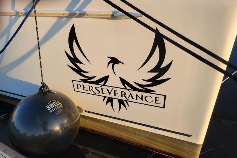  Yacht Photos Pics 2006 Fountaine Pajot LAVEZZI boat with "Perseverance" logo and Swell Wakesurf fender.