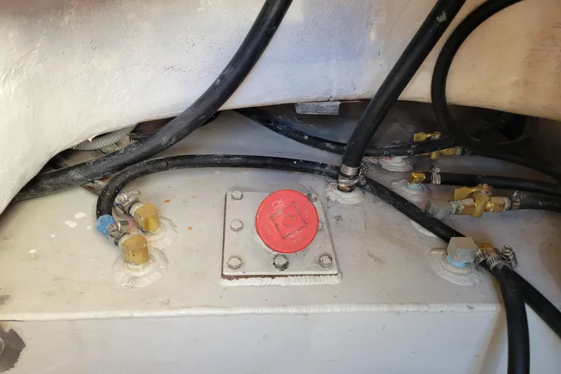  Yacht Photos Pics Engine compartment of 2006 Fountaine Pajot LAVEZZI with hoses and red cap.