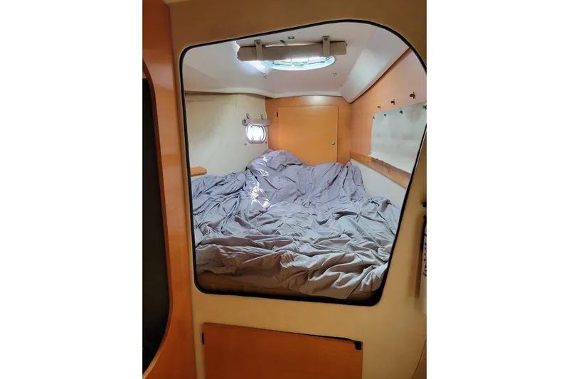  Yacht Photos Pics Interior cabin of 2006 Fountaine Pajot LAVEZZI catamaran with cozy bedding.