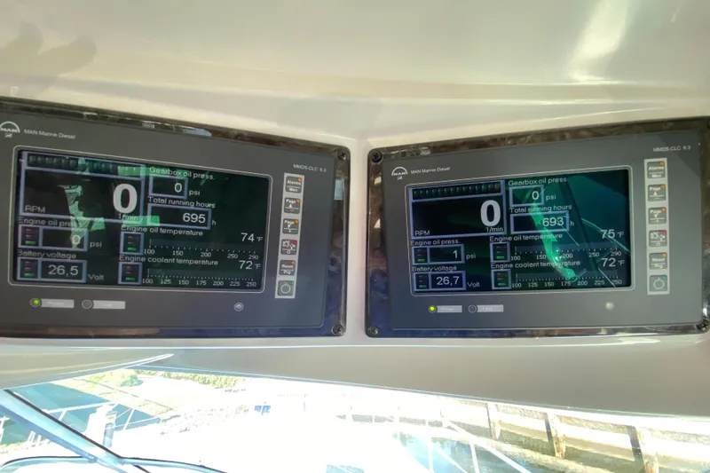  Yacht Photos Pics Control panels on a 2012 Sea Ray 610 Sundancer displaying engine metrics and diagnostics.