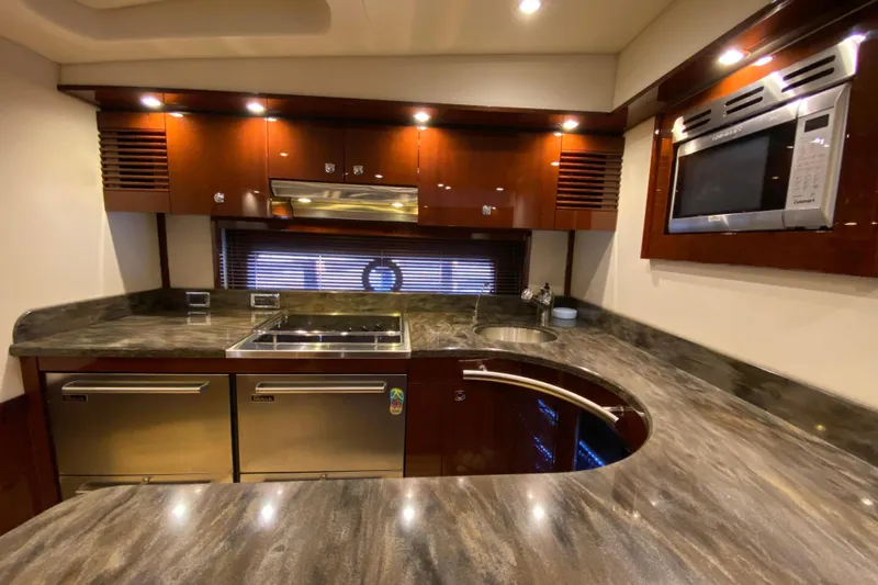  Yacht Photos Pics Luxurious kitchen interior of 2012 Sea Ray 610 Sundancer yacht with modern appliances.