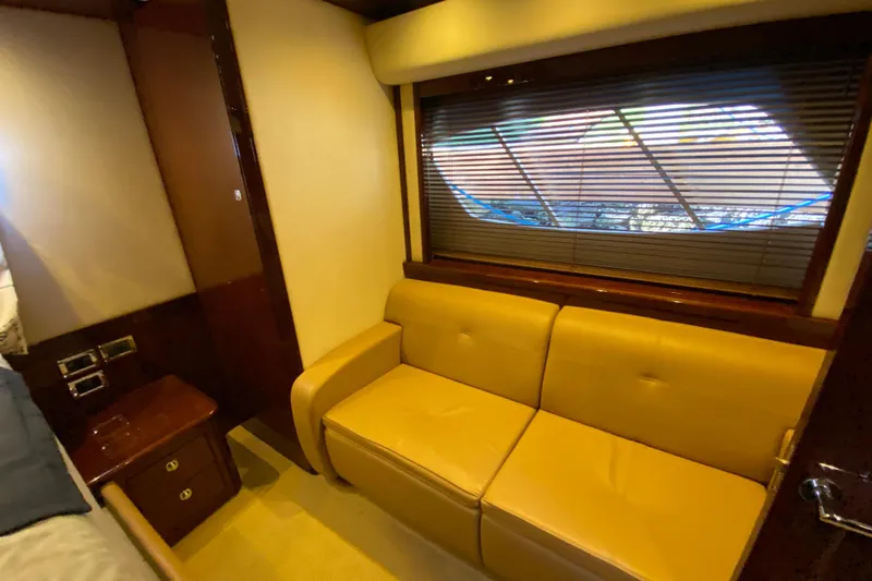  Yacht Photos Pics Luxurious interior of 2012 Sea Ray 610 Sundancer yacht with beige leather sofa.