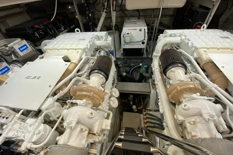  Yacht Photos Pics Engine room of a 2012 Sea Ray 610 Sundancer yacht, showcasing dual engines and equipment.