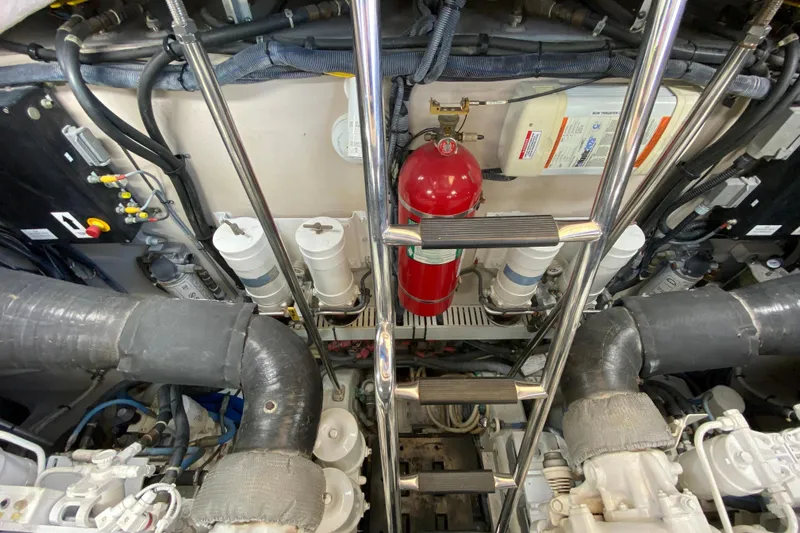  Yacht Photos Pics Engine room of 2012 Sea Ray 610 Sundancer with fire extinguisher and mechanical components.