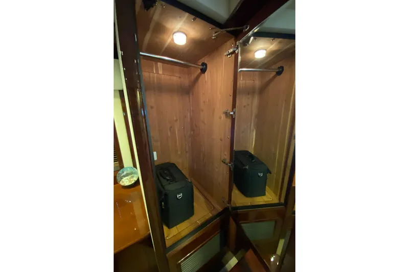  Yacht Photos Pics Wooden closet interior on 2012 Sea Ray 610 Sundancer yacht.