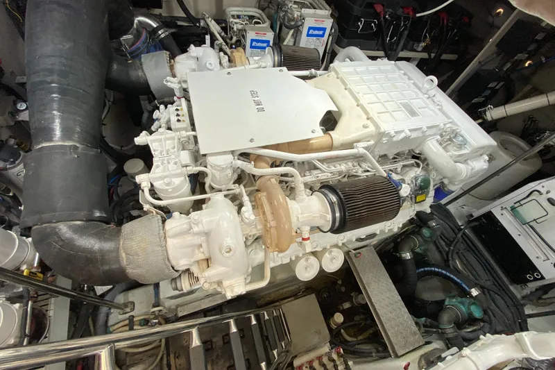  Yacht Photos Pics Engine room of a 2012 Sea Ray 610 Sundancer yacht, showcasing detailed machinery.