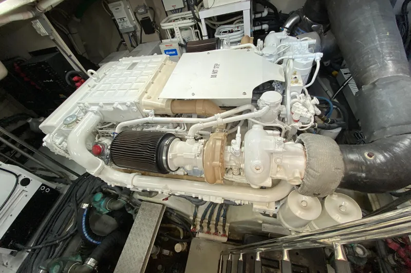  Yacht Photos Pics Engine room of a 2012 Sea Ray 610 Sundancer yacht, showcasing detailed machinery.