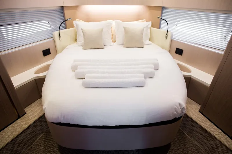 Mawi Yacht Photos Pics Luxurious bedroom interior of 2019 Azimut FLY 55 yacht with elegant bedding.