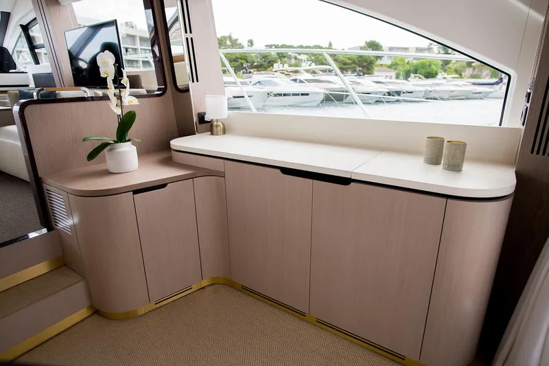 Mawi Yacht Photos Pics Luxurious interior of 2019 Azimut FLY 55 yacht with elegant cabinetry and decor.