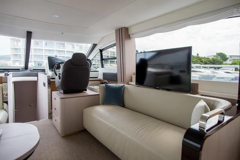 Mawi Yacht Photos Pics Luxurious interior of 2019 Azimut FLY 55 yacht with modern seating and helm station.