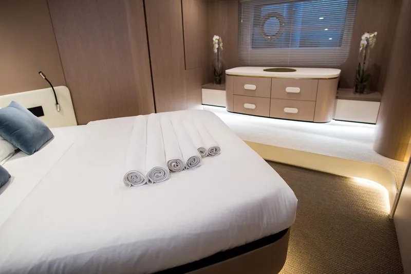 Mawi Yacht Photos Pics Luxurious bedroom interior of 2019 Azimut FLY 55 yacht with modern design and elegant decor.