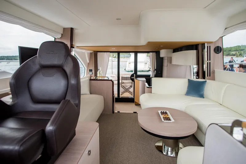 Mawi Yacht Photos Pics Luxurious interior of 2019 Azimut FLY 55 yacht with modern seating and elegant decor.