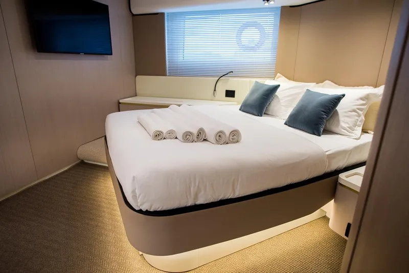 Mawi Yacht Photos Pics Luxurious bedroom interior of 2019 Azimut FLY 55 yacht with modern decor and cozy bedding.