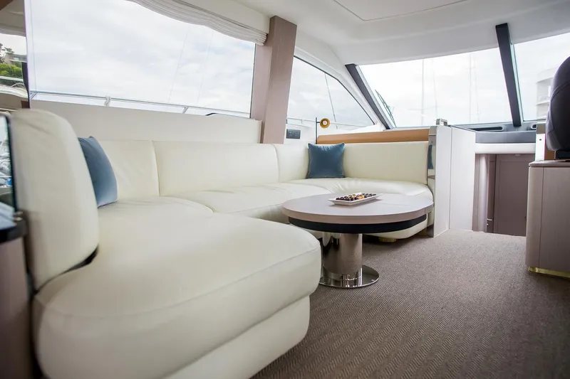 Mawi Yacht Photos Pics Luxurious interior of 2019 Azimut FLY 55 yacht with white leather seating and modern decor.