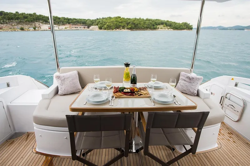 Mawi Yacht Photos Pics Luxurious dining setup on 2019 Azimut FLY 55 yacht with ocean view.