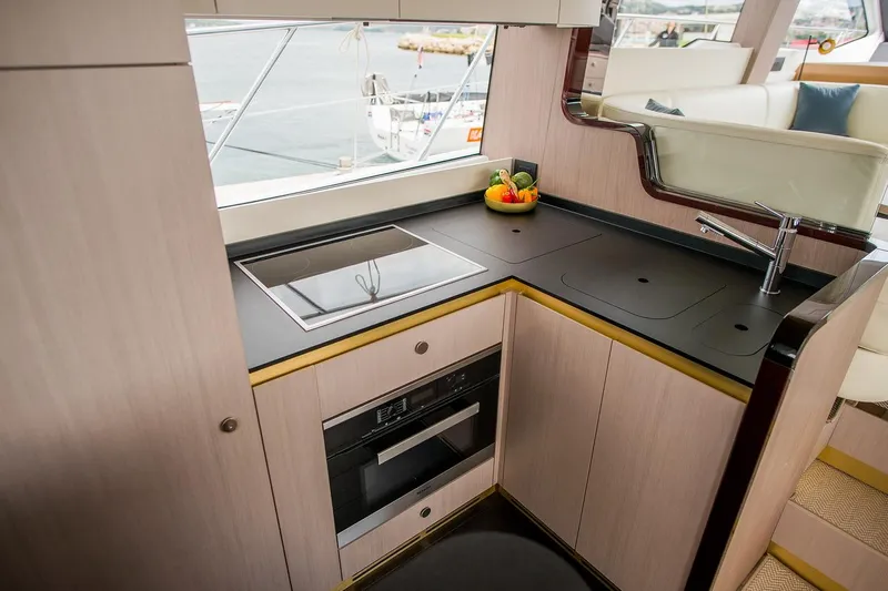 Mawi Yacht Photos Pics Luxurious kitchen area in 2019 Azimut FLY 55 yacht with modern appliances.