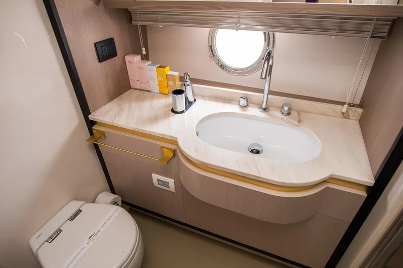 Mawi Yacht Photos Pics Luxurious bathroom in 2019 Azimut FLY 55 yacht with modern sink and toilet.