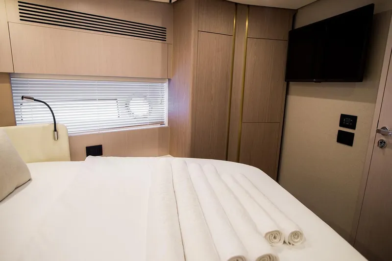 Mawi Yacht Photos Pics Luxurious bedroom interior of 2019 Azimut FLY 55 yacht with modern design and amenities.