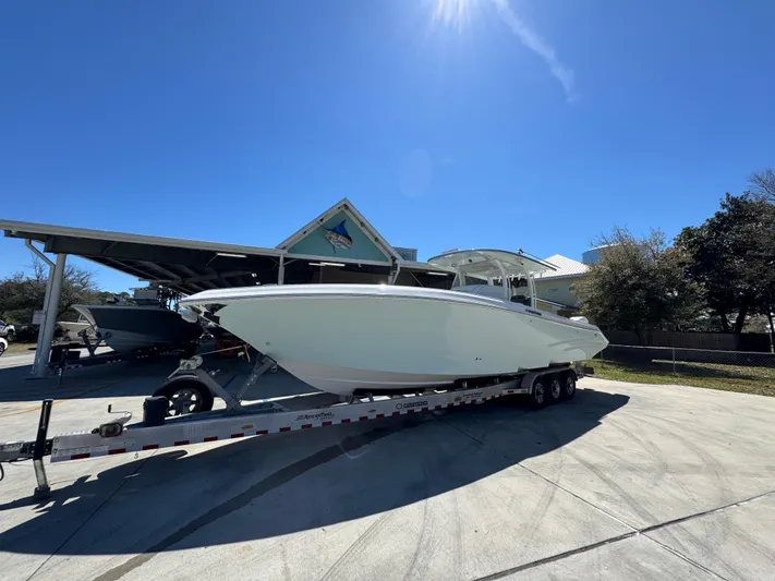  Yacht Photos Pics 2019 Fountain 39 NX boat on trailer under clear blue sky.