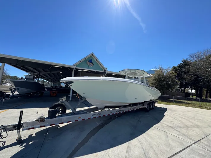  Yacht Photos Pics 2019 Fountain 39 NX boat on trailer under clear blue sky.