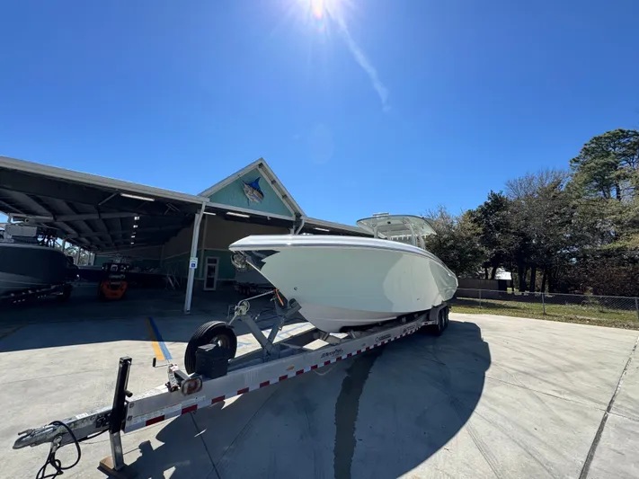  Yacht Photos Pics 2019 Fountain 39 NX boat on trailer under clear blue sky.